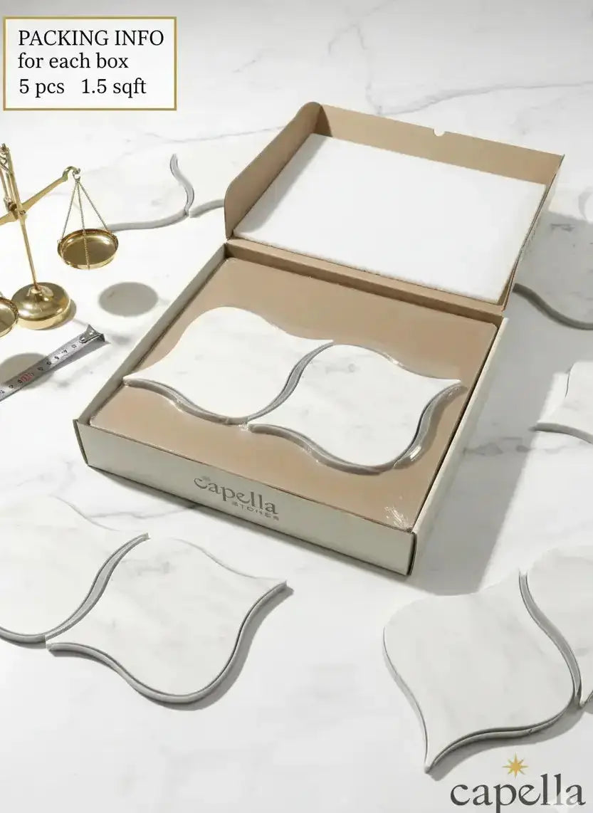 Capella Atelier packaging with decorative items on a marble surface