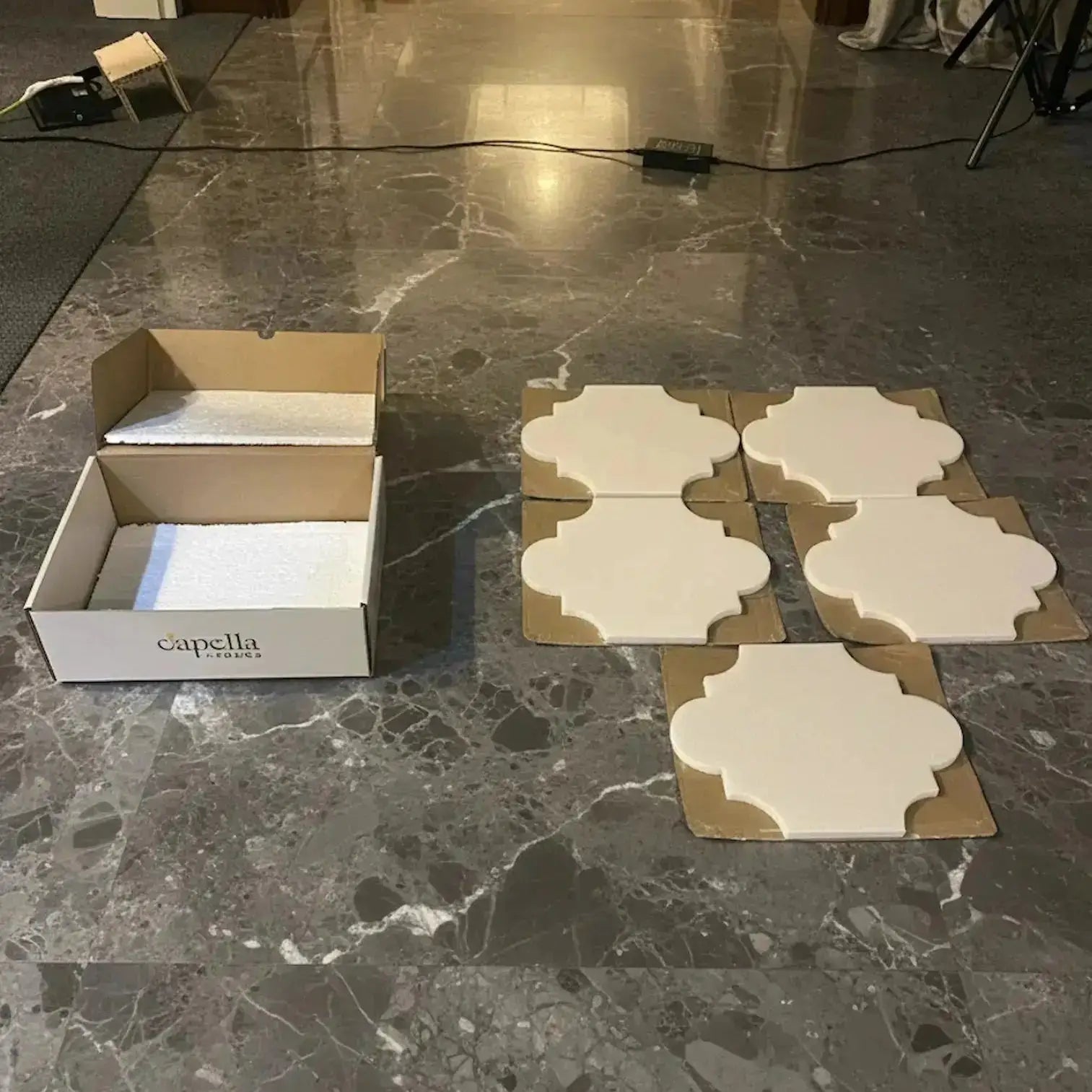 Decorative tiles and a 'Capella' branded box on a marble floor. single wall kitchen design diseño de cocina de una sola pared
bathroom medicine cabinet installation instalación de botiquín de baño