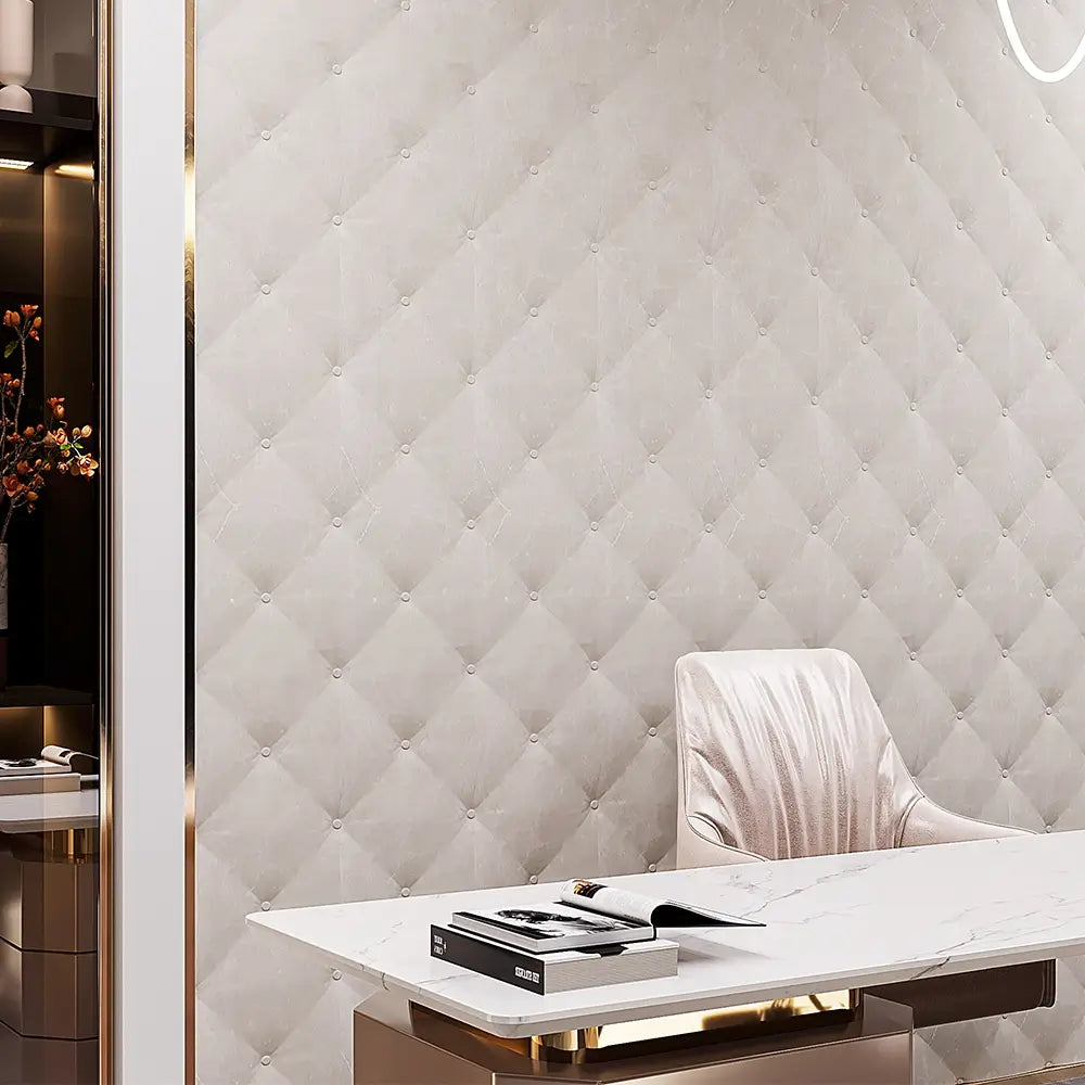 Modern interior with a quilted wall panel and a white table.