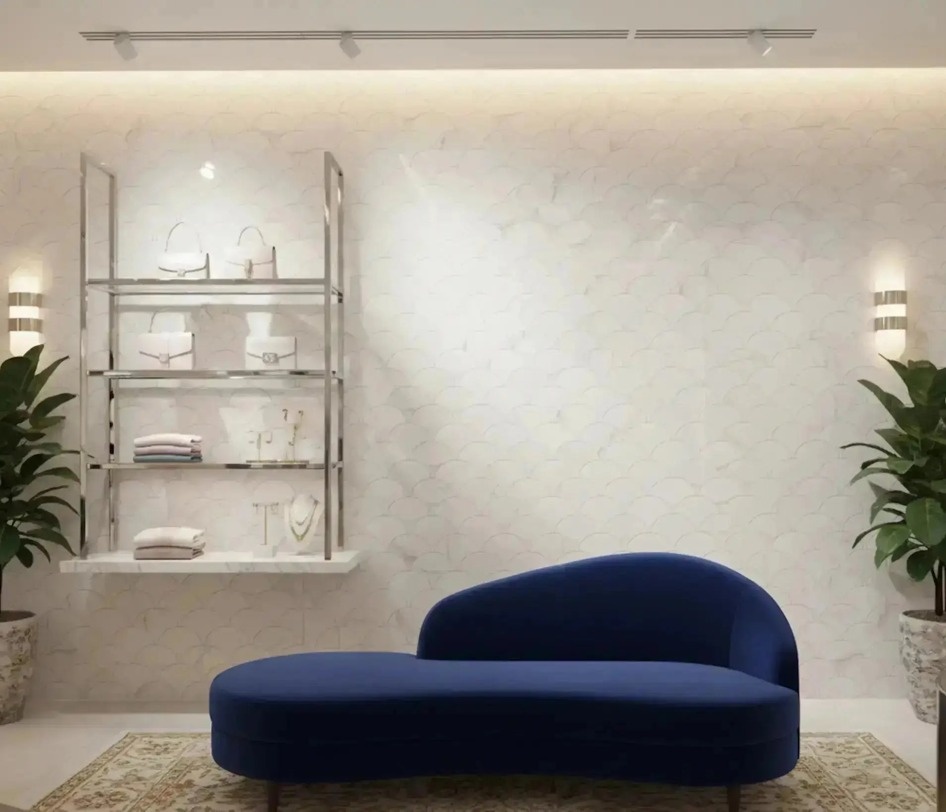Modern blue sofa in a stylish room with marble wall and decorative shelves.