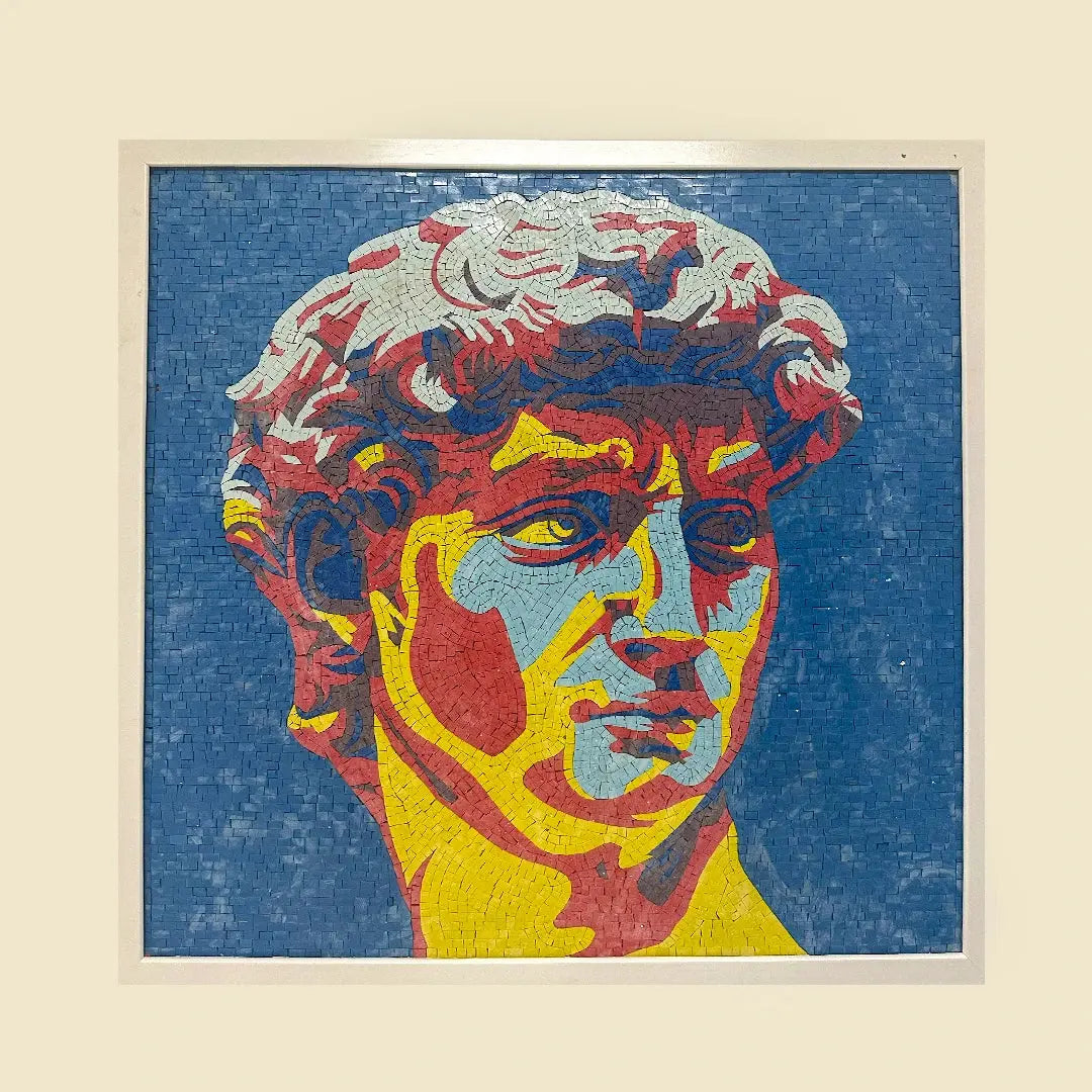 Colorful mosaic art of a classical statue head on a textured blue background