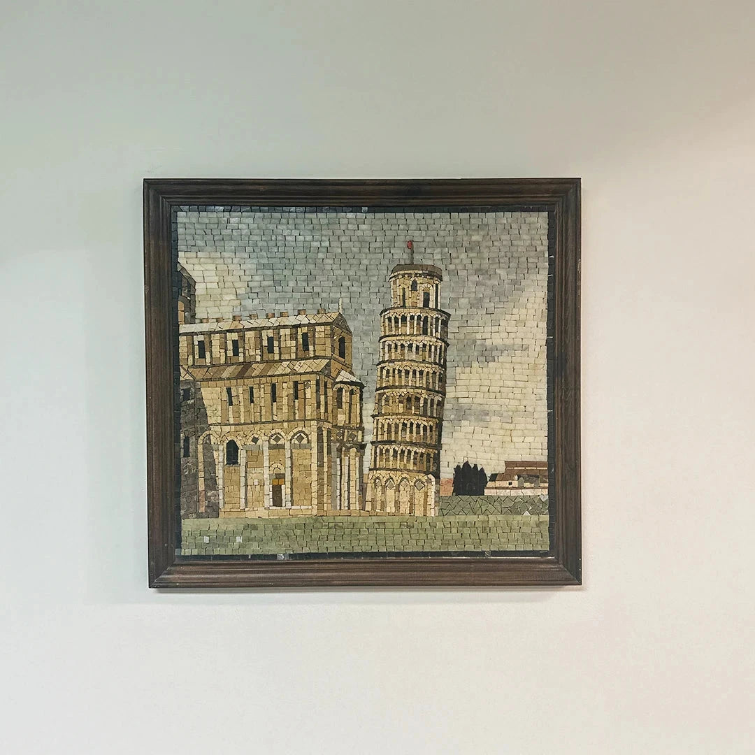 Framed mosaic artwork of the Leaning Tower of Pisa on a white wall