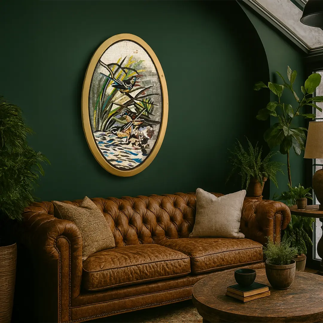 Brown leather sofa in a room with green walls, decorative painting, and plants.
