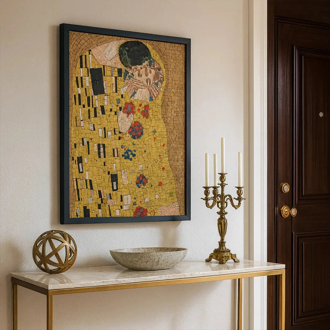 Framed artwork resembling 'The Kiss' by Gustav Klimt on a wall above a marble console table.