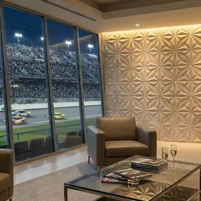 Living room with a view of a race track through large windows, featuring a brown armchair and glass coffee table. tile inc
regrouting
floors and walls
universal tile
laying tile
tile center
quality tile
the tile shop near me