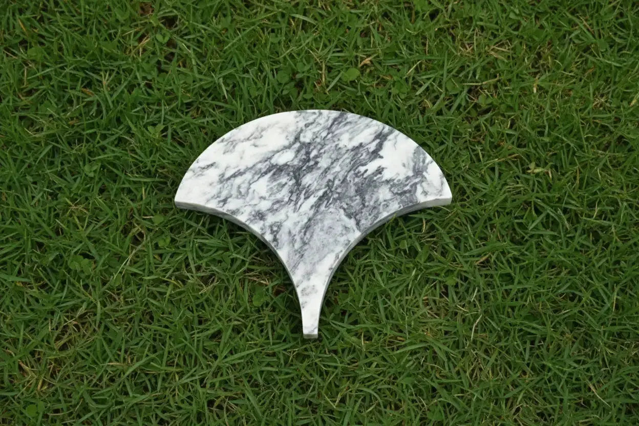 Marble-patterned half-circle stone on a white background- marble-luxury-tile-quality-installation