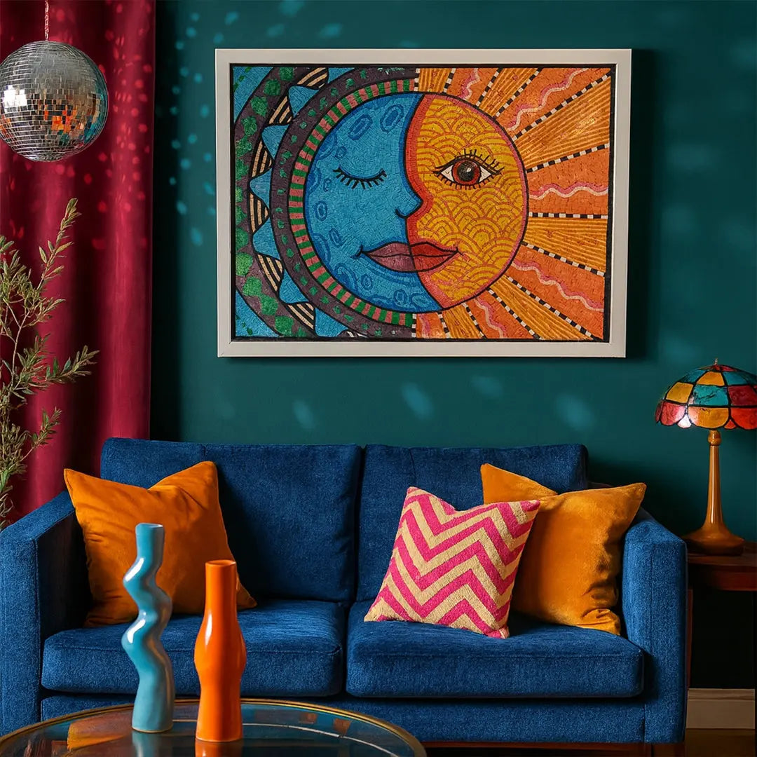 Colorful abstract artwork of a face with a blue and orange design above a blue sofa with patterned cushions.