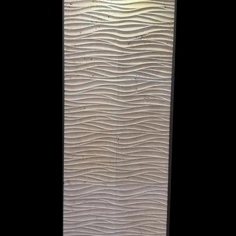 Medea 3D wall panel featuring a continuous, flowing horizontal wave pattern carved into light-toned natural stone.