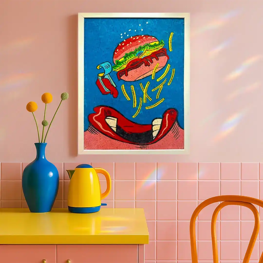 Colorful abstract art piece on a pink wall with a yellow table and blue vase. 