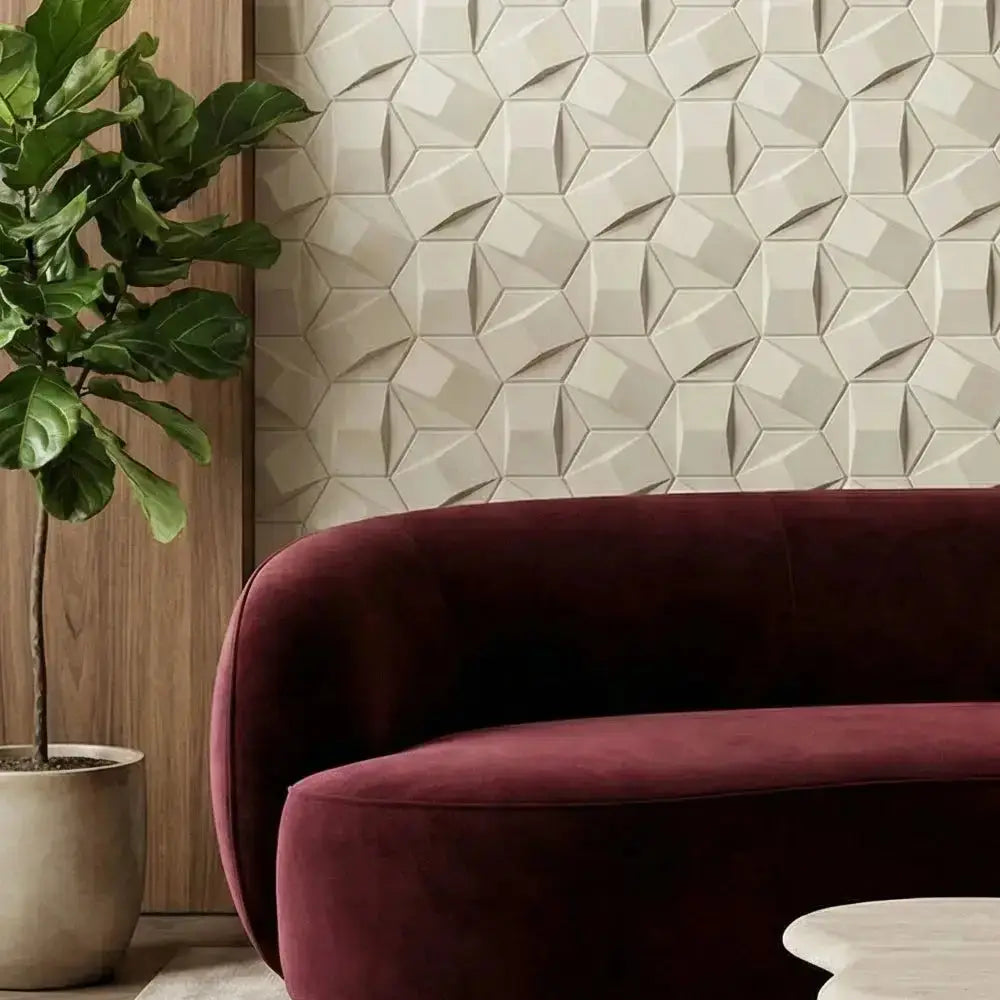Maroon sofa against a geometric-patterned wall with a potted plant on the left. marble market
marble factory
raw marble
most expensive marble in the world
the marble shop
marble place
marble worktops