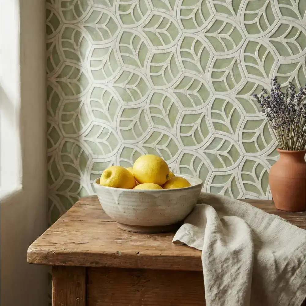 Bowl of lemons on a wooden table with decorative wallpaper in the background. luxury-water jet-tile
