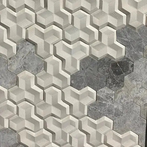 Tabu 3D wall tile installation featuring a geometric, multi-dimensional pattern blending textured light tones and contrasting dark grey natural stone surfaces.